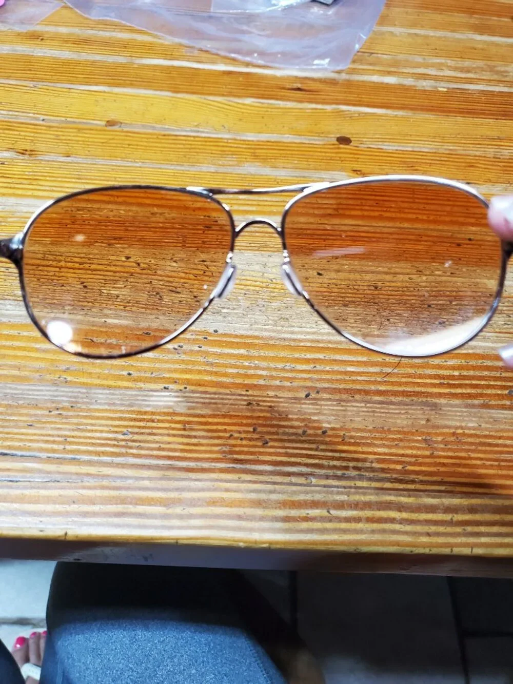 Oakley Caveat aviator sunglasses featuring a rose gold metal frame and warm brow